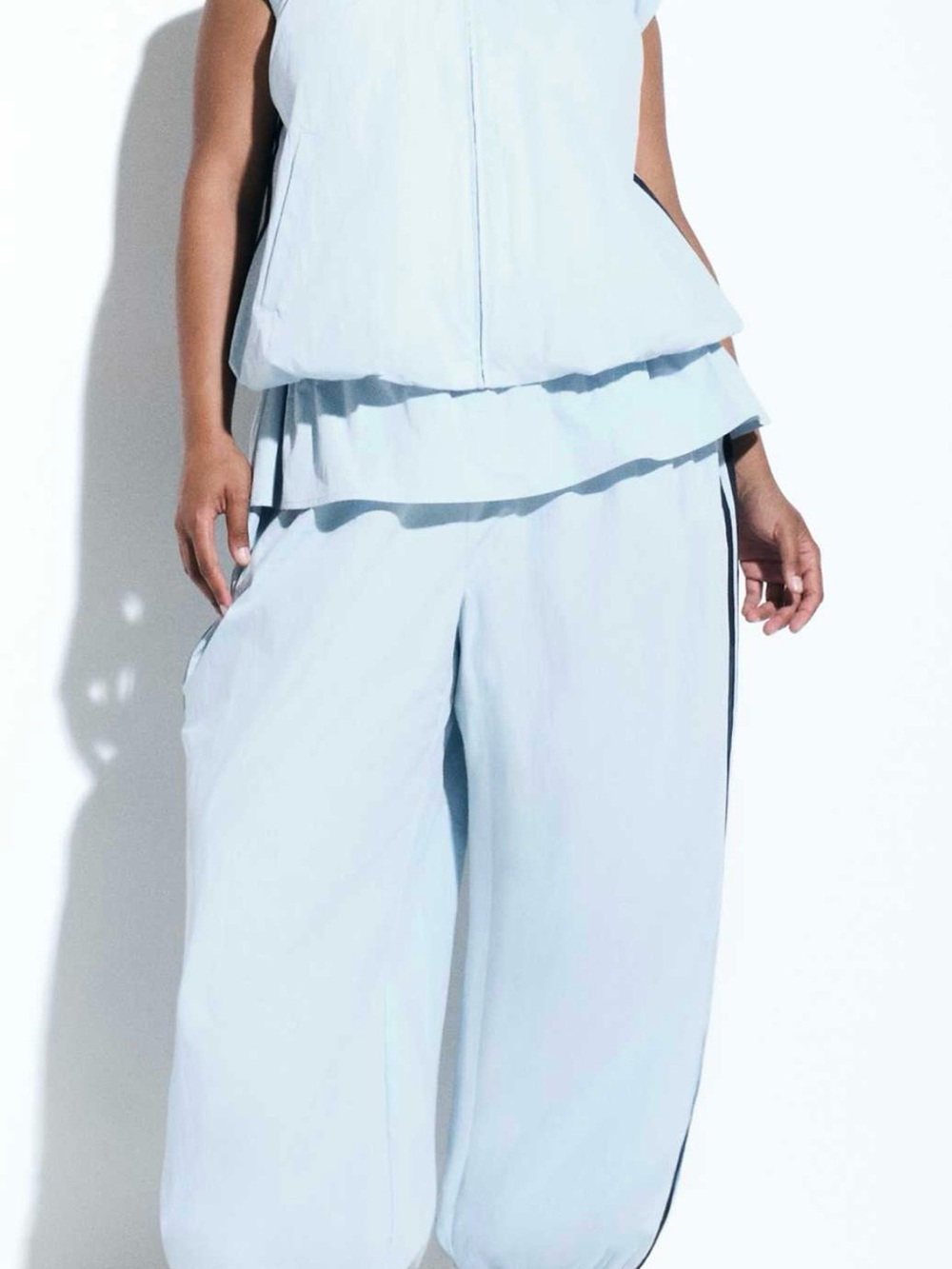 adidas Light Blue Wide-Leg Women's Pants with skirt overlay.